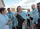 Director of the agricultural enterprise Ozeritsky-Agro Nina Zheleznova shows Gerard Depardieu around the farm 