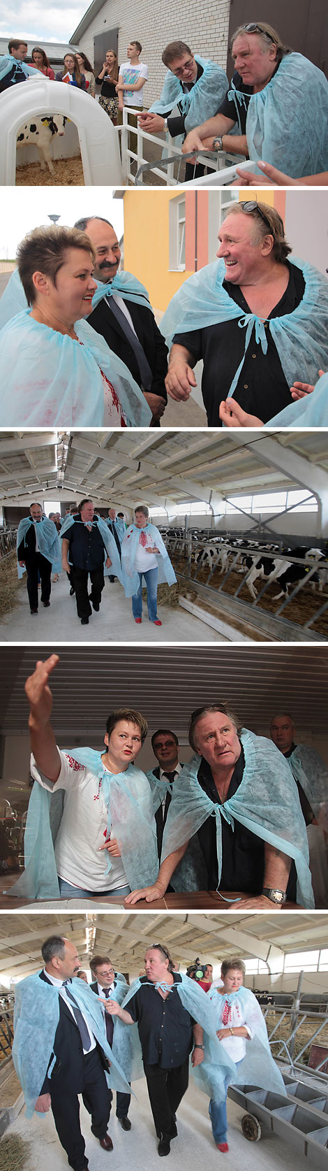 Director of the agricultural enterprise Ozeritsky-Agro Nina Zheleznova shows Gerard Depardieu around the farm 