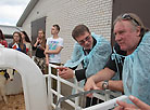 Director of the agricultural enterprise Ozeritsky-Agro Nina Zheleznova shows Gerard Depardieu around the farm 
