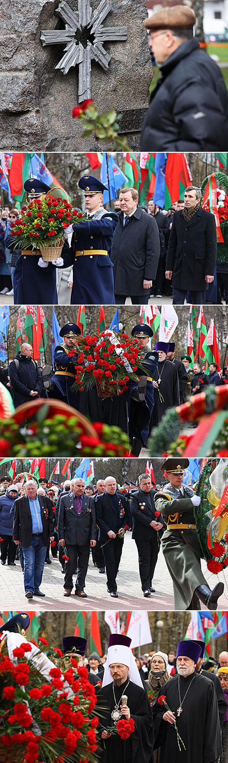 Flowers are laid at the memorial signs For Victims of Chernobyl and Hiroshima Peace Stone in Minsk