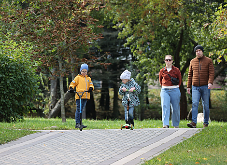 Promenade in an autumn park