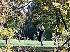 Posing against a rowan tree