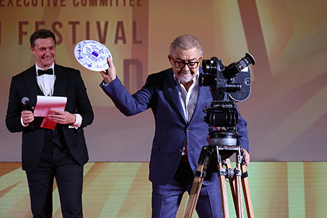 A symbolic plate of the film festival is smashed by Chairman of the 27th Minsk International Film Festival Listapad, People's Artist of Belarus Aleksandr Efremov