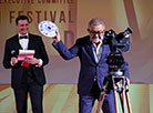 A symbolic plate of the film festival is smashed by Chairman of the 27th Minsk International Film Festival Listapad, People's Artist of Belarus Aleksandr Efremov