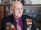 Veteran Pavel Kozlov from Mogilev accepts congratulations on the upcoming Victory Day