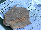 Family coats of arms of Polotsk Prince Izyaslav on a fragment of houseware