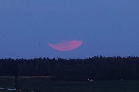 Penumbral lunar eclipse and a flower moon over Grodno