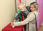 Member of the election commission Alexander Kachayev seals a ballot box at polling station No. 39 of Leninsky District of Mogilev