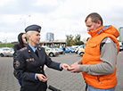 
On Car-Free Day Minsk traffic policemen presented reflective elements and calendars to car owners on bicycles