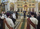 Belarus President Alexander Lukashenko lights Christmas candle in Holy Spirit Cathedral in Minsk