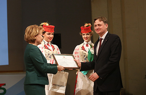 Sergei Komkov, Director of OAO 8 Marta, is awarded with an honorary diploma of the National Assembly of Belarus