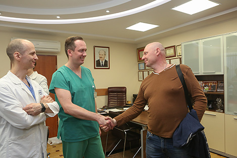 Heart surgeon Vladimir Andrushchuk, patient Leonid Vokhmin and heart surgeon Vitaly Odintsov