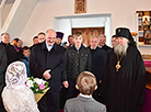 Alexander Lukashenko lights the candle in the Holy Transfiguration Church on Easter 