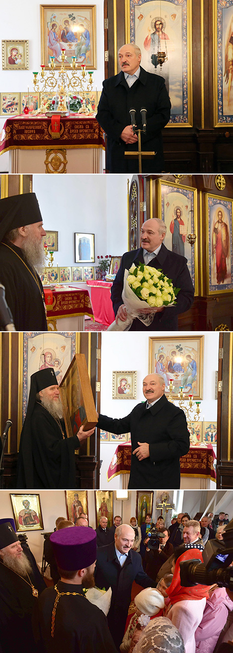 Alexander Lukashenko lights the candle in the Holy Transfiguration Church on Easter 