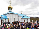 Alexander Lukashenko lights the candle in the Holy Transfiguration Church on Easter 