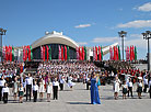 Thousands join the singing of the National Anthem in National Flag Square