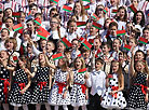 Thousands join the singing of the National Anthem in National Flag Square