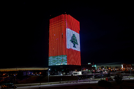 Building in Minsk lit up in colors of Lebanese flag