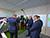 Lukashenko inspects milking robot developed by TV maker Horizont