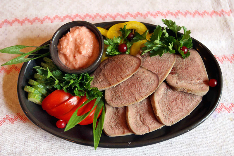 Sliced beef tongue with horseradish sauce