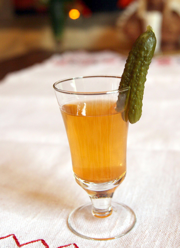 Khrenavukha z agurochkam, home-made vodka with garlic and horseradish flavour. Served with a small cucumber