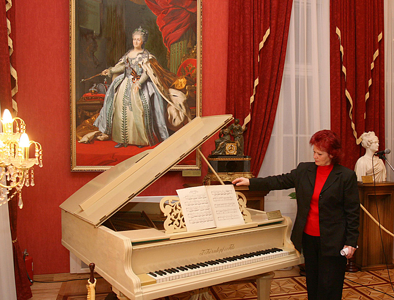 Grand piano of the late XIX - early XX century in Red Living Room