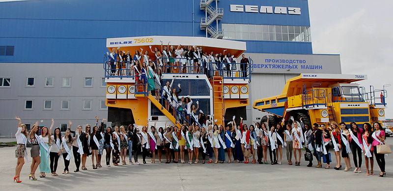 Miss Supranational 2013 participants are shown gigantic BelAZ trucks
