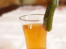 Khrenavukha z agurochkam, home-made vodka with garlic and horseradish flavour. Served with a small cucumber