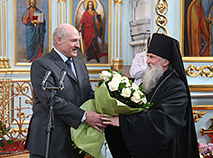 Belarus President Aleksandr Lukashenko attends Easter service in a church in one of Belarusian regions