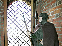 Knight standing at the window of the Kamenets Tower