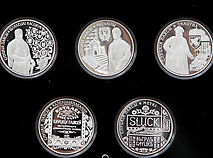 The Slutsk Belts commemorative coins issued by the National Bank of the Republic of Belarus and the Slutsk Belts stamp in honor of the Belarusian national relic.